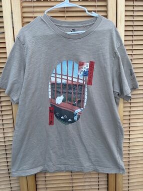 Uniqlo Taupe Graphic Tee with Scenic Window and White Cat